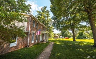 This stunning 2-story home offers 4 bedrooms, 2 full baths, and on Oak Meadow Country Club in Missouri - for sale on GolfHomes.com, golf home, golf lot