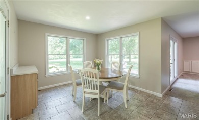 This stunning 2-story home offers 4 bedrooms, 2 full baths, and on Oak Meadow Country Club in Missouri - for sale on GolfHomes.com, golf home, golf lot