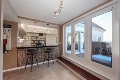 Penthouse living at its finest! This rare two-story home on the on Sky Meadow Country Club in New Hampshire - for sale on GolfHomes.com, golf home, golf lot