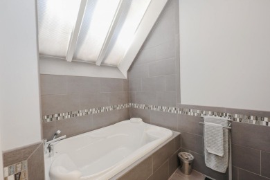 Penthouse living at its finest! This rare two-story home on the on Sky Meadow Country Club in New Hampshire - for sale on GolfHomes.com, golf home, golf lot
