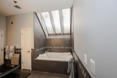 Penthouse living at its finest! This rare two-story home on the on Sky Meadow Country Club in New Hampshire - for sale on GolfHomes.com, golf home, golf lot