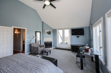 Penthouse living at its finest! This rare two-story home on the on Sky Meadow Country Club in New Hampshire - for sale on GolfHomes.com, golf home, golf lot