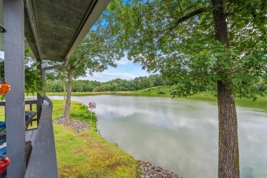 Vista View across a large pond with a fairway beyond. One of on Diamondhead Golf and Country Club in Arkansas - for sale on GolfHomes.com, golf home, golf lot