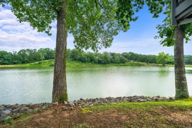 Vista View across a large pond with a fairway beyond. One of on Diamondhead Golf and Country Club in Arkansas - for sale on GolfHomes.com, golf home, golf lot