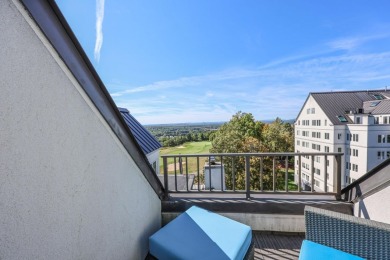 Penthouse living at its finest! This rare two-story home on the on Sky Meadow Country Club in New Hampshire - for sale on GolfHomes.com, golf home, golf lot