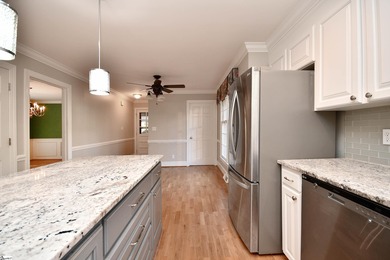 Discover this beautifully crafted all-brick 5-bedroom, 3-bath on Holly Tree Country Club in South Carolina - for sale on GolfHomes.com, golf home, golf lot