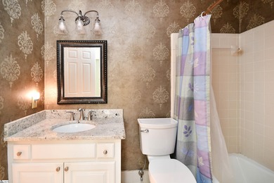 Discover this beautifully crafted all-brick 5-bedroom, 3-bath on Holly Tree Country Club in South Carolina - for sale on GolfHomes.com, golf home, golf lot