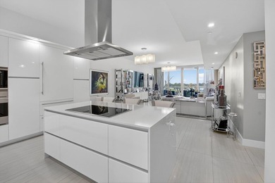 Dazzling golf and sparkling lake views await in this stunning on Boca West Golf and Country Club in Florida - for sale on GolfHomes.com, golf home, golf lot