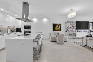 Dazzling golf and sparkling lake views await in this stunning on Boca West Golf and Country Club in Florida - for sale on GolfHomes.com, golf home, golf lot