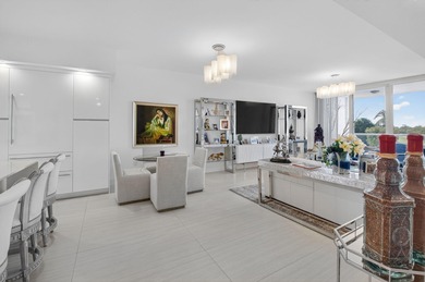 Dazzling golf and sparkling lake views await in this stunning on Boca West Golf and Country Club in Florida - for sale on GolfHomes.com, golf home, golf lot