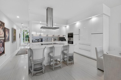 Dazzling golf and sparkling lake views await in this stunning on Boca West Golf and Country Club in Florida - for sale on GolfHomes.com, golf home, golf lot