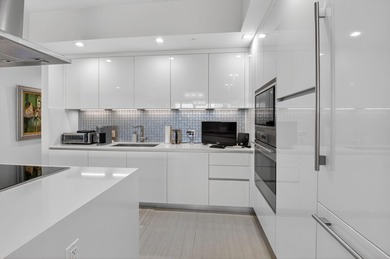 Dazzling golf and sparkling lake views await in this stunning on Boca West Golf and Country Club in Florida - for sale on GolfHomes.com, golf home, golf lot