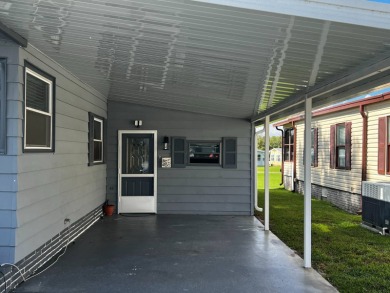 Recent Renovations make this 2 bedroom 2 bath,1987 Palm Harbor on Lake Henry Golf Club in Florida - for sale on GolfHomes.com, golf home, golf lot