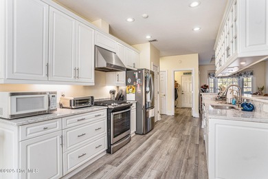 Live where every day feels like vacation! This custom, all brick on Sea Trail Golf Resort in North Carolina - for sale on GolfHomes.com, golf home, golf lot