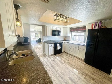 Desirable end unit at Stonebridge golf course community! on London Bridge Golf Course in Arizona - for sale on GolfHomes.com, golf home, golf lot