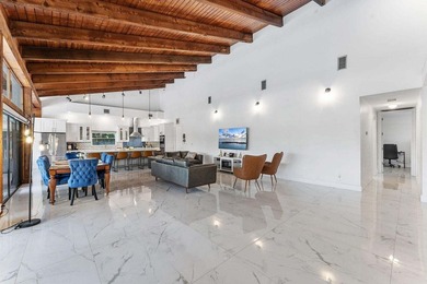 Modern yet inviting, this reimagined residence offers 2,897 sqft on Ocean Breeze Golf and Country Club in Florida - for sale on GolfHomes.com, golf home, golf lot
