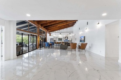 Modern yet inviting, this reimagined residence offers 2,897 sqft on Ocean Breeze Golf and Country Club in Florida - for sale on GolfHomes.com, golf home, golf lot