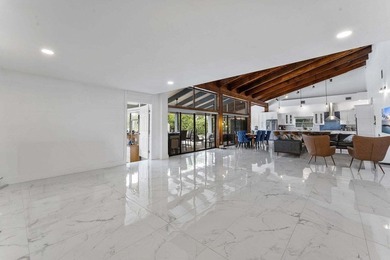 Modern yet inviting, this reimagined residence offers 2,897 sqft on Ocean Breeze Golf and Country Club in Florida - for sale on GolfHomes.com, golf home, golf lot