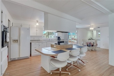 Enjoy the temperate winter weather with plenty of outdoor living on Riverbend Golf and Country Club in Florida - for sale on GolfHomes.com, golf home, golf lot