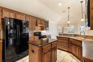 What a view!  This beautiful home looks over the 7th fairway of on Whitestone Golf Club in Texas - for sale on GolfHomes.com, golf home, golf lot