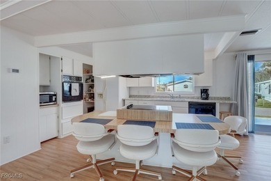 Enjoy the temperate winter weather with plenty of outdoor living on Riverbend Golf and Country Club in Florida - for sale on GolfHomes.com, golf home, golf lot