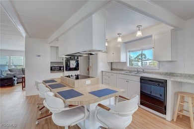 Enjoy the temperate winter weather with plenty of outdoor living on Riverbend Golf and Country Club in Florida - for sale on GolfHomes.com, golf home, golf lot