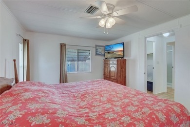 Enjoy the temperate winter weather with plenty of outdoor living on Riverbend Golf and Country Club in Florida - for sale on GolfHomes.com, golf home, golf lot