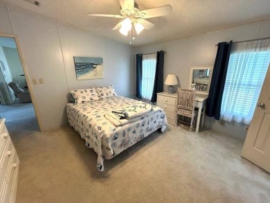 Discover this beautiful turnkey 2-bedroom, 2-bathroom home on Crystal Lake Club in Florida - for sale on GolfHomes.com, golf home, golf lot