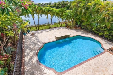 Exquisite 2-story pool home w/serene lake views in the on Parkland Golf Club in Florida - for sale on GolfHomes.com, golf home, golf lot