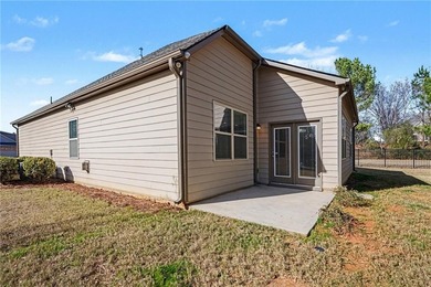 Hidden at the end of a quiet cul-de-sac in Heron Bay Villas on Canongate At Heron Bay in Georgia - for sale on GolfHomes.com, golf home, golf lot