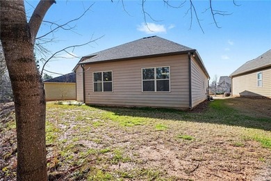 Hidden at the end of a quiet cul-de-sac in Heron Bay Villas on Canongate At Heron Bay in Georgia - for sale on GolfHomes.com, golf home, golf lot