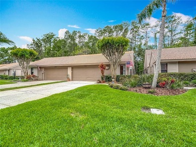 Palm Harbor - Nestled in the gated community of Wescott Square on Tarpon Woods Golf Club in Florida - for sale on GolfHomes.com, golf home, golf lot