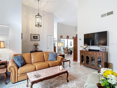 Palm Harbor - Nestled in the gated community of Wescott Square on Tarpon Woods Golf Club in Florida - for sale on GolfHomes.com, golf home, golf lot