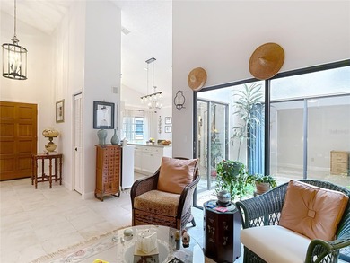 Palm Harbor - Nestled in the gated community of Wescott Square on Tarpon Woods Golf Club in Florida - for sale on GolfHomes.com, golf home, golf lot