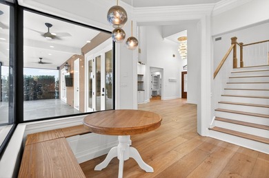 This exquisite home, located on the 15th green of Regatta Bay's on Regatta Bay Golf and Country Club in Florida - for sale on GolfHomes.com, golf home, golf lot