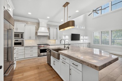 This exquisite home, located on the 15th green of Regatta Bay's on Regatta Bay Golf and Country Club in Florida - for sale on GolfHomes.com, golf home, golf lot