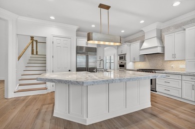 This exquisite home, located on the 15th green of Regatta Bay's on Regatta Bay Golf and Country Club in Florida - for sale on GolfHomes.com, golf home, golf lot