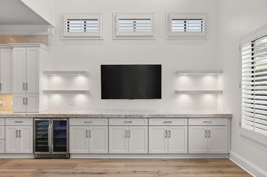 This exquisite home, located on the 15th green of Regatta Bay's on Regatta Bay Golf and Country Club in Florida - for sale on GolfHomes.com, golf home, golf lot