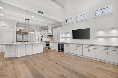 This exquisite home, located on the 15th green of Regatta Bay's on Regatta Bay Golf and Country Club in Florida - for sale on GolfHomes.com, golf home, golf lot