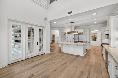 This exquisite home, located on the 15th green of Regatta Bay's on Regatta Bay Golf and Country Club in Florida - for sale on GolfHomes.com, golf home, golf lot