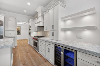 This exquisite home, located on the 15th green of Regatta Bay's on Regatta Bay Golf and Country Club in Florida - for sale on GolfHomes.com, golf home, golf lot