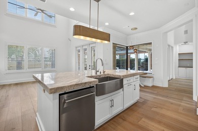 This exquisite home, located on the 15th green of Regatta Bay's on Regatta Bay Golf and Country Club in Florida - for sale on GolfHomes.com, golf home, golf lot