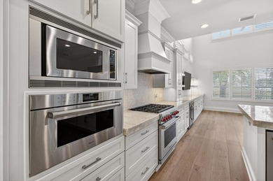 This exquisite home, located on the 15th green of Regatta Bay's on Regatta Bay Golf and Country Club in Florida - for sale on GolfHomes.com, golf home, golf lot