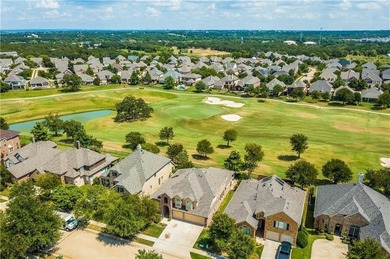 Meticulously maintained 2-story overlooking the second hole of on Lantana Golf Club in Texas - for sale on GolfHomes.com, golf home, golf lot