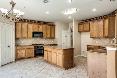 Meticulously maintained 2-story overlooking the second hole of on Lantana Golf Club in Texas - for sale on GolfHomes.com, golf home, golf lot