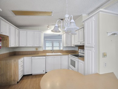 Welcome Home to this charming LAND OWNED 2/2 with a 2020 roof on Spanish Lakes Golf Village in Florida - for sale on GolfHomes.com, golf home, golf lot