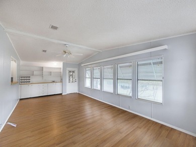 Welcome Home to this charming LAND OWNED 2/2 with a 2020 roof on Spanish Lakes Golf Village in Florida - for sale on GolfHomes.com, golf home, golf lot