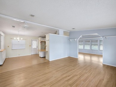 Welcome Home to this charming LAND OWNED 2/2 with a 2020 roof on Spanish Lakes Golf Village in Florida - for sale on GolfHomes.com, golf home, golf lot