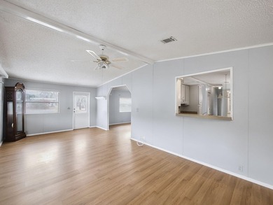 Welcome Home to this charming LAND OWNED 2/2 with a 2020 roof on Spanish Lakes Golf Village in Florida - for sale on GolfHomes.com, golf home, golf lot