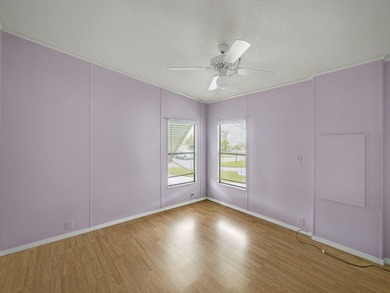 Welcome Home to this charming LAND OWNED 2/2 with a 2020 roof on Spanish Lakes Golf Village in Florida - for sale on GolfHomes.com, golf home, golf lot